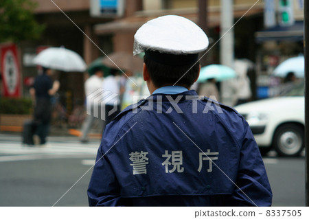 Cops watching pedestrians (rain) Cops watching pedestrians (rain) 8337505