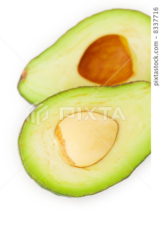two halves of avocado isolated on white two halves of avocado isolated on white 8337716