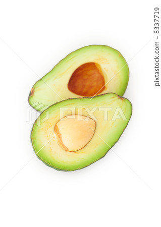 two halves of avocado isolated on white two halves of avocado isolated on white 8337719