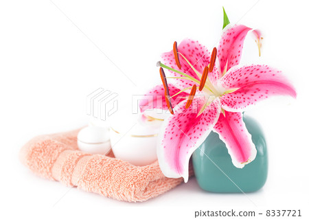 beautiful lily in a vase, towel and cosmetic containers beautiful lily in a vase, towel and cosmetic containers 8337721