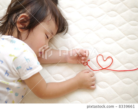 Sleeping baby and heart 8339661