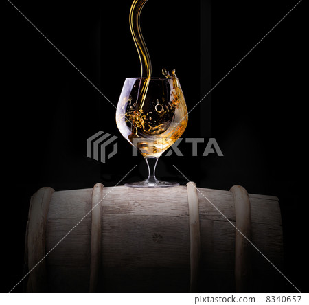 Cognac or brandy on a black 8340657