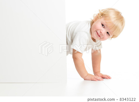 Funny kid on all fours behind banner 8343122