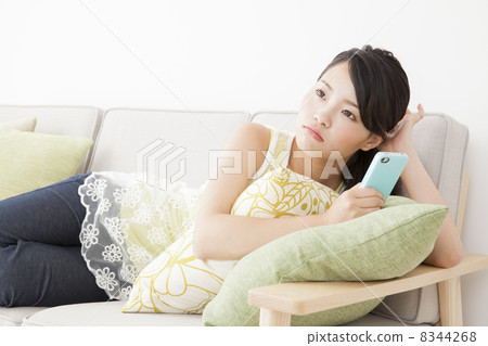 A woman relaxing in the room 8344268