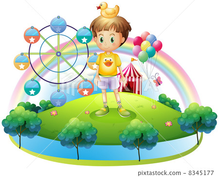 A boy with a rubber duck in an island with a carnival A boy with a rubber duck in an island with a carnival 8345177
