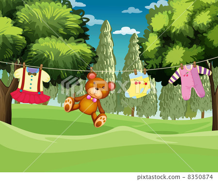 A teddy bear and clothes hanging A teddy bear and clothes hanging 8350874