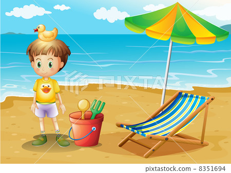 A young boy and his toys at the beach 8351694