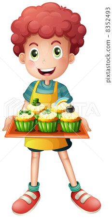 A young baker holding a tray with cupcakes A young baker holding a tray with cupcakes 8352493