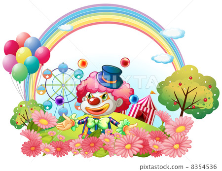 A clown in the garden with a carnival at the back A clown in the garden with a carnival at the back 8354536