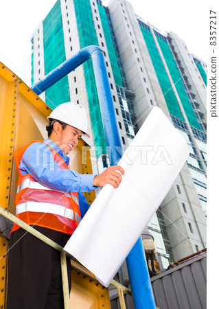 Asian worker or supervisor on building site 8357217