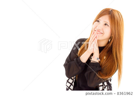 A young and cute girl who is pleased to fit both hands in front of the face 8361962