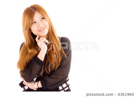 A pretty Japanese woman who imagines something fun and laughs A pretty Japanese woman who imagines something fun and laughs 8361969