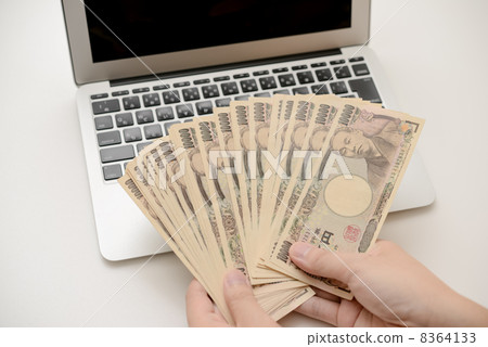 Banknote and laptop computer Banknote and laptop computer 8364133