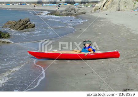A child riding a sea kayak for children A child riding a sea kayak for children 8368559