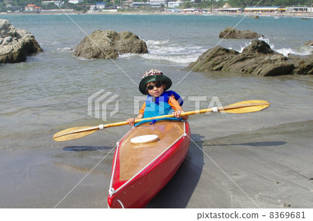 A child wearing at a sea kayak for children 8369681
