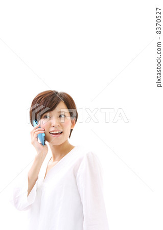 A woman talking on a smartphone A woman talking on a smartphone 8370527