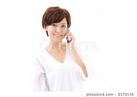 A woman talking on a smartphone A woman talking on a smartphone 8370536