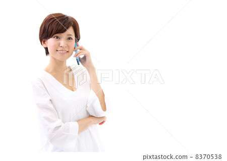 A woman talking on a smartphone A woman talking on a smartphone 8370538