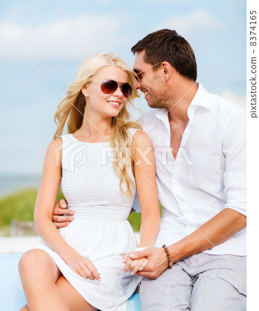 couple in shades at seaside couple in shades at seaside 8374165