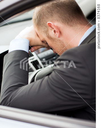 tired businessman or taxi car driver tired businessman or taxi car driver 8374168