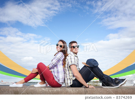 teenagers sitting back to back 8374269
