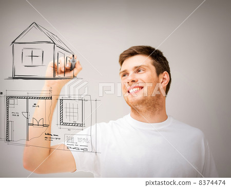 man drawing blueprint on virtual screen 8374474