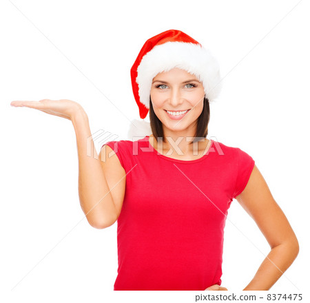 woman in santa helper hat with something on palm 8374475