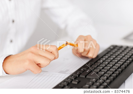 woman breaking pencil 8374476