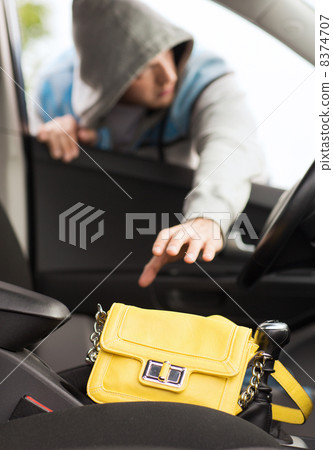 thief stealing bag from the car thief stealing bag from the car 8374707