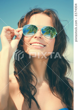 woman in bikini and sunglasses 8374904