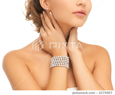 beautiful woman with pearl earrings and bracelet beautiful woman with pearl earrings and bracelet 8374907