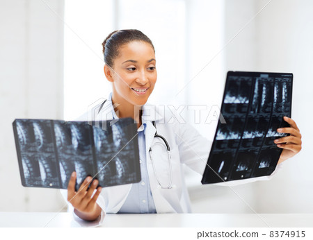 african doctor looking at x-ray african doctor looking at x-ray 8374915