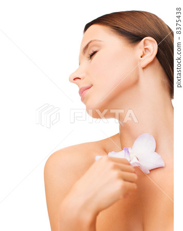relaxed woman with orhid flower relaxed woman with orhid flower 8375438