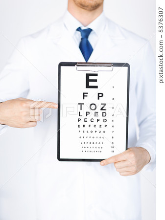 male ophthalmologist with eye chart male ophthalmologist with eye chart 8376307