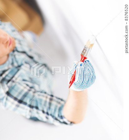 hand coloring wall with paintbrush hand coloring wall with paintbrush 8376520