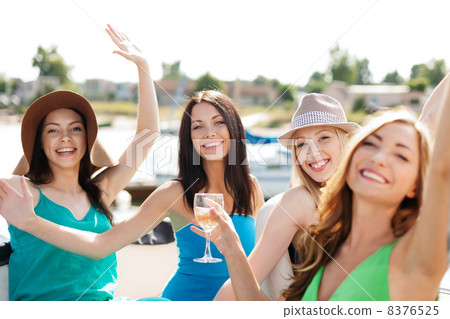 girls with champagne glasses on boat girls with champagne glasses on boat 8376525