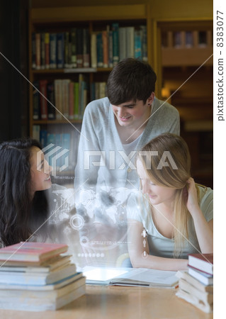 Happy students working together with futuristic interface Happy students working together with futuristic interface 8383077