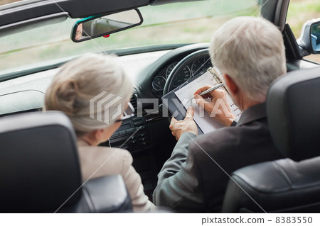 Business people working together in classy convertible 8383550