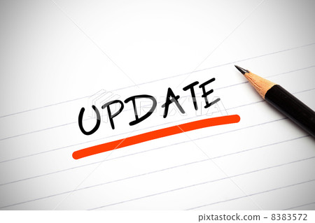The word update written on a notepad 8383572