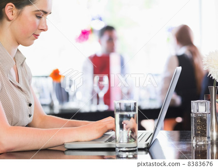 Businesswoman working on laptop Businesswoman working on laptop 8383676