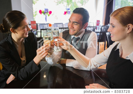 Business people celebrating a success with champagne Business people celebrating a success with champagne 8383728