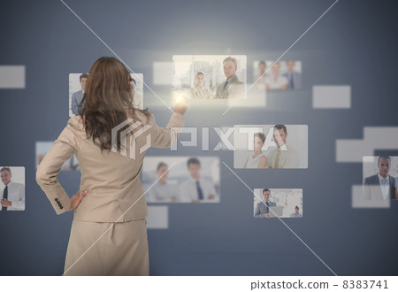 Businesswoman selecting digital interface Businesswoman selecting digital interface 8383741