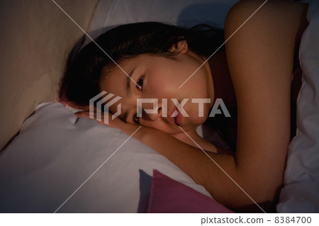 Young asian woman suffering from insomnia Young asian woman suffering from insomnia 8384700