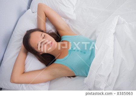 Brunette sleeping peacefully in bed Brunette sleeping peacefully in bed 8385063