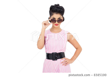 Pretty black hair model looking over her sunglasses Pretty black hair model looking over her sunglasses 8385100