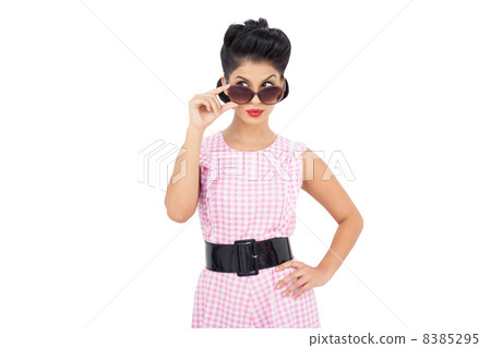 Playful black hair model looking over her sunglasses Playful black hair model looking over her sunglasses 8385295
