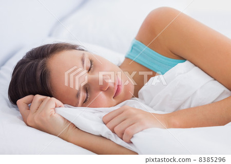 Beautiful brunette sleeping peacefully in bed Beautiful brunette sleeping peacefully in bed 8385296