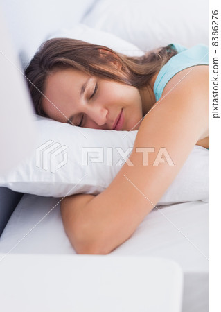 Attractive brunette sleeping peacefully in bed Attractive brunette sleeping peacefully in bed 8386276
