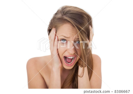 Afraid brunette model holding her head and screaming Afraid brunette model holding her head and screaming 8386667