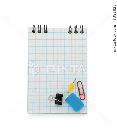 school supplies on checked notebook 8388823